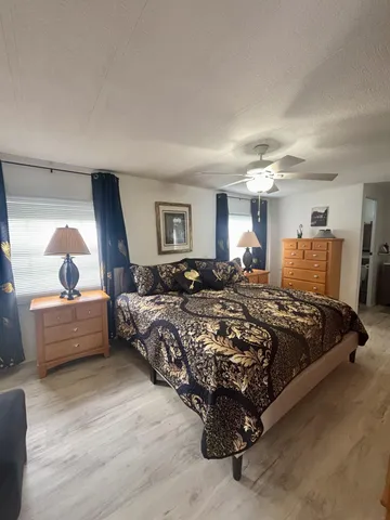 a bed room with a bed and a dresser