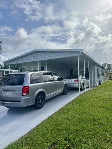 a view of car parked in front of house