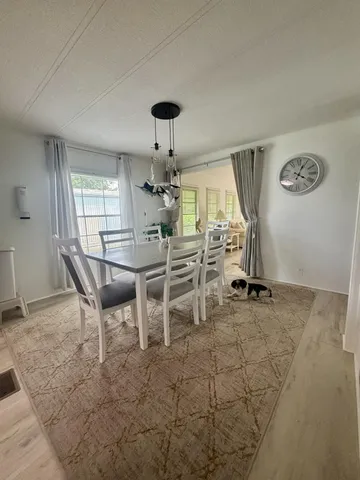 a view of a livingroom with chairs