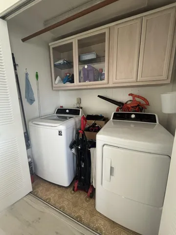a utility room with dryer and washer