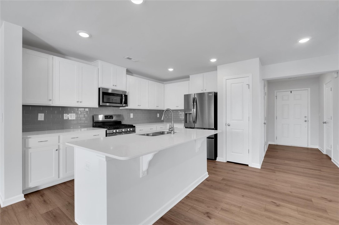 515 Brasstown Court Pendleton, SC 29670 - Photo 6 of 25 This modern kitchen features stainless steal appliances, including a gas range, as well as an inviting island, perfect for culinary endeavors and gatherings.