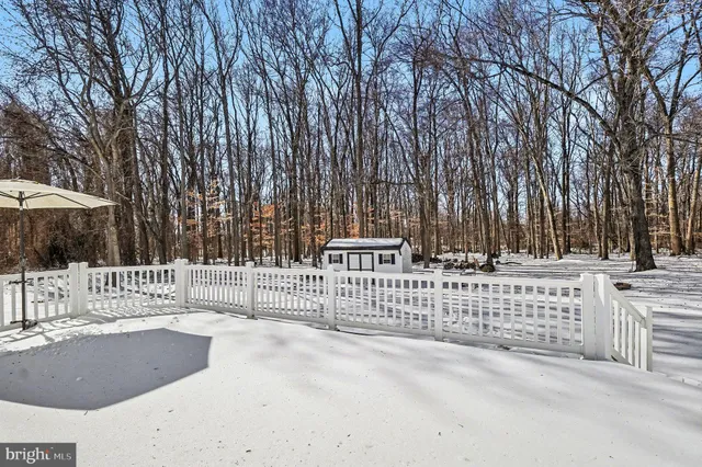 a view of a park with iron fence