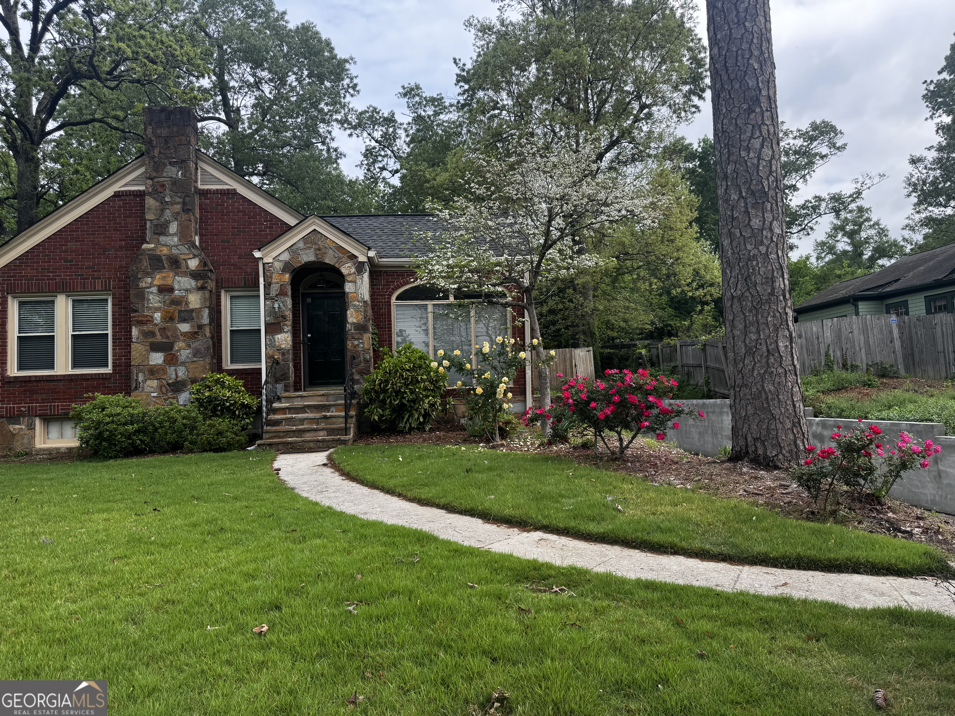 210 Charlton Street Northwest Rome, GA 30165 - Photo 1 of 1 a front view of house with yard and green space