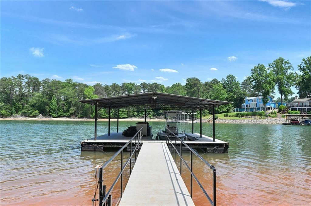 2040 Ridge Road Cumming, GA 30041 - Photo 50 of 52 a view of a lake with sitting area