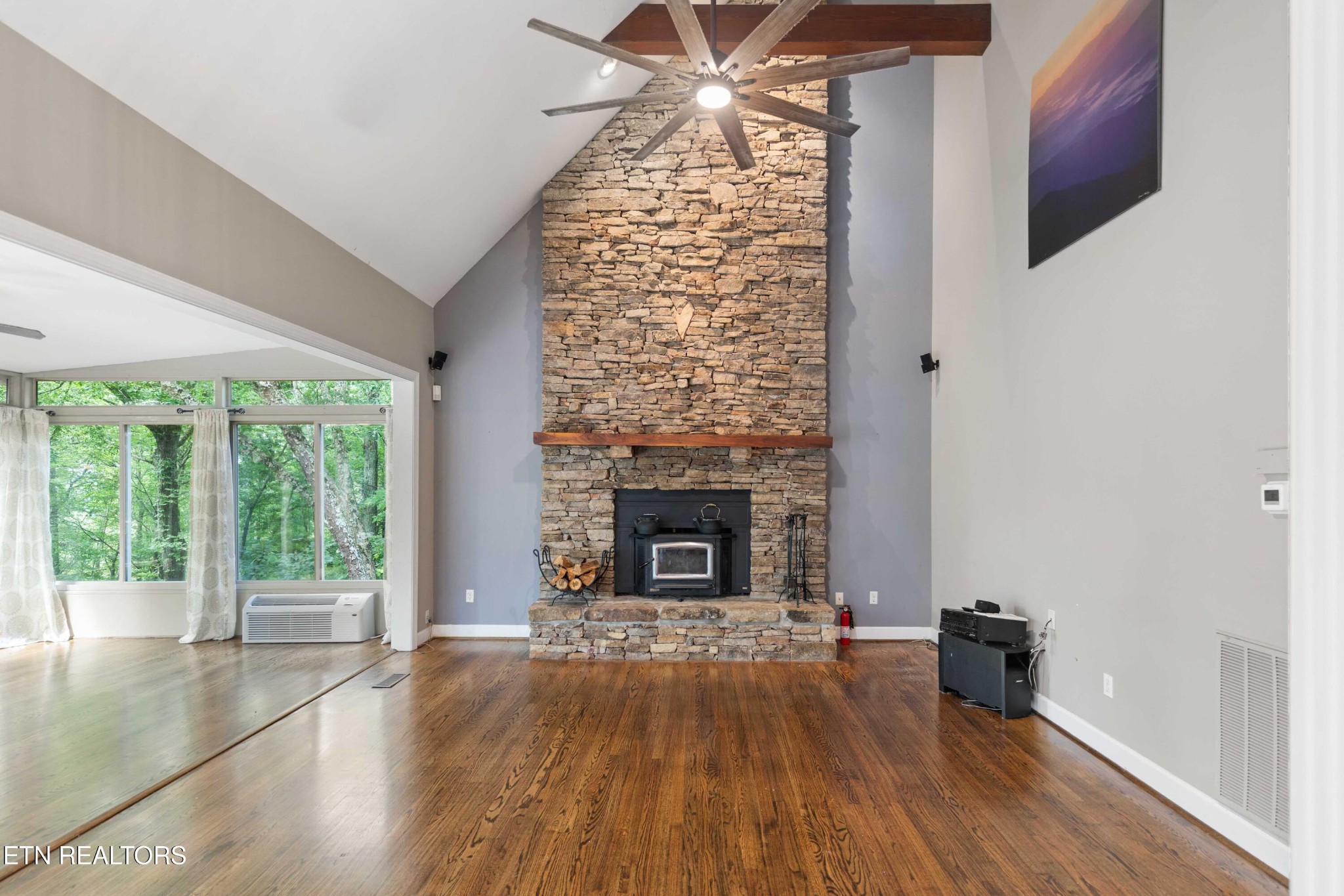309 Bullrun Valley Drive Heiskell, TN 37754 - Photo 11 of 49 a living room with a fireplace and wooden floor