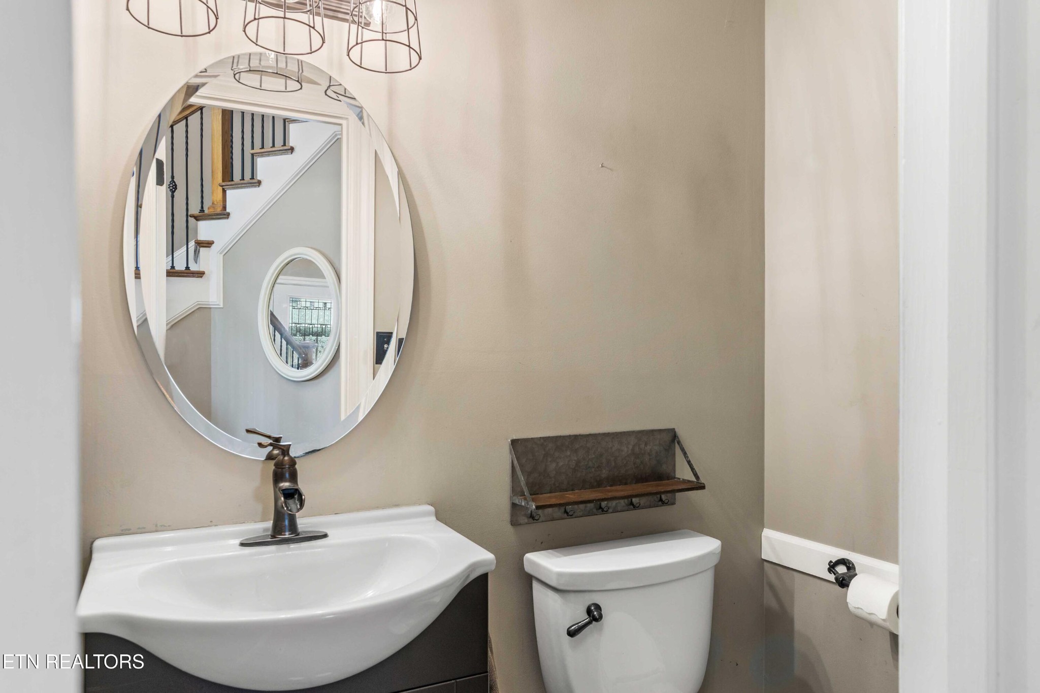 309 Bullrun Valley Drive Heiskell, TN 37754 - Photo 23 of 49 a bathroom with a sink a toilet and a mirror