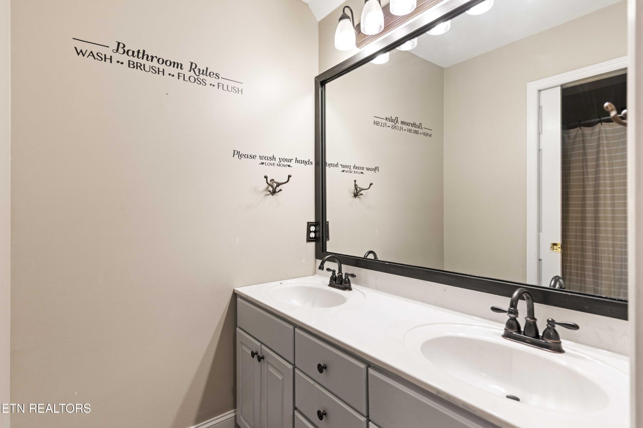 309 Bullrun Valley Drive Heiskell, TN 37754 - Photo 34 of 49 a bathroom with a sink and a mirror