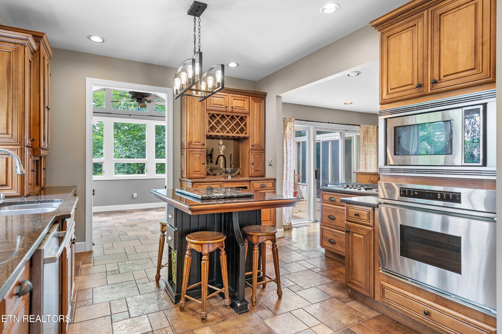 309 Bullrun Valley Drive Heiskell, TN 37754 - Photo 4 of 49 a kitchen with stainless steel appliances granite countertop a stove a refrigerator and a microwave