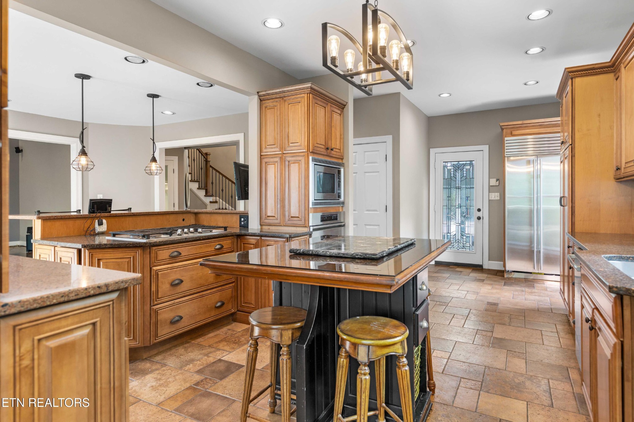 309 Bullrun Valley Drive Heiskell, TN 37754 - Photo 5 of 49 a kitchen with stainless steel appliances granite countertop a sink a stove and a refrigerator