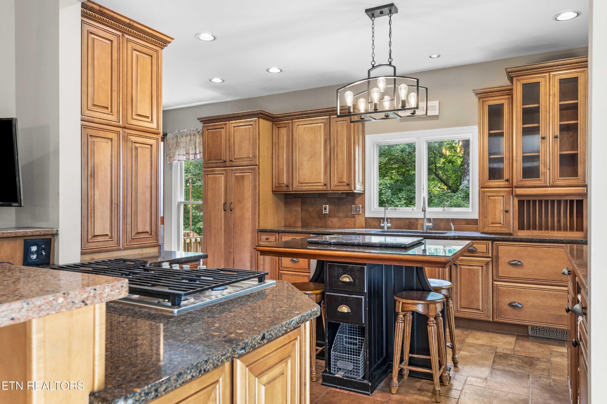 309 Bullrun Valley Drive Heiskell, TN 37754 - Photo 6 of 49 a kitchen with kitchen island granite countertop a stove a sink and a refrigerator