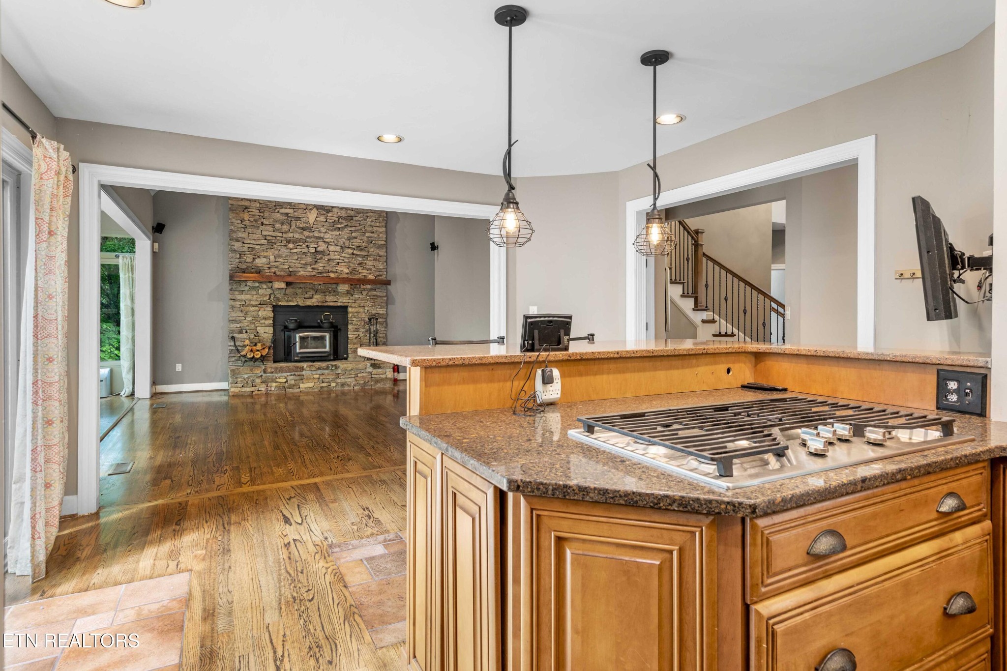 309 Bullrun Valley Drive Heiskell, TN 37754 - Photo 7 of 49 a kitchen with a stove a sink a refrigerator and a fireplace