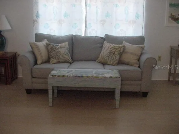 a living room with furniture and a couch