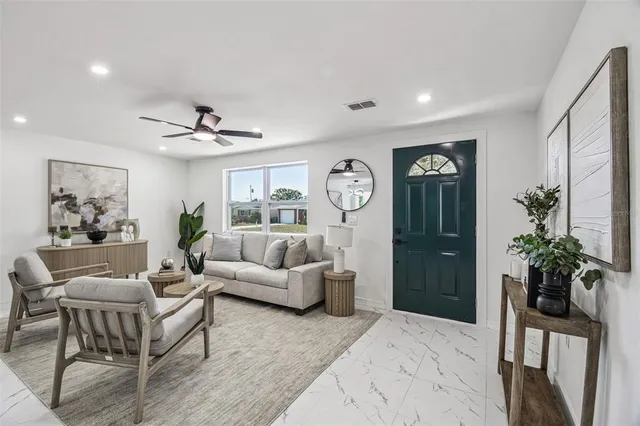 a living room with furniture and a large window