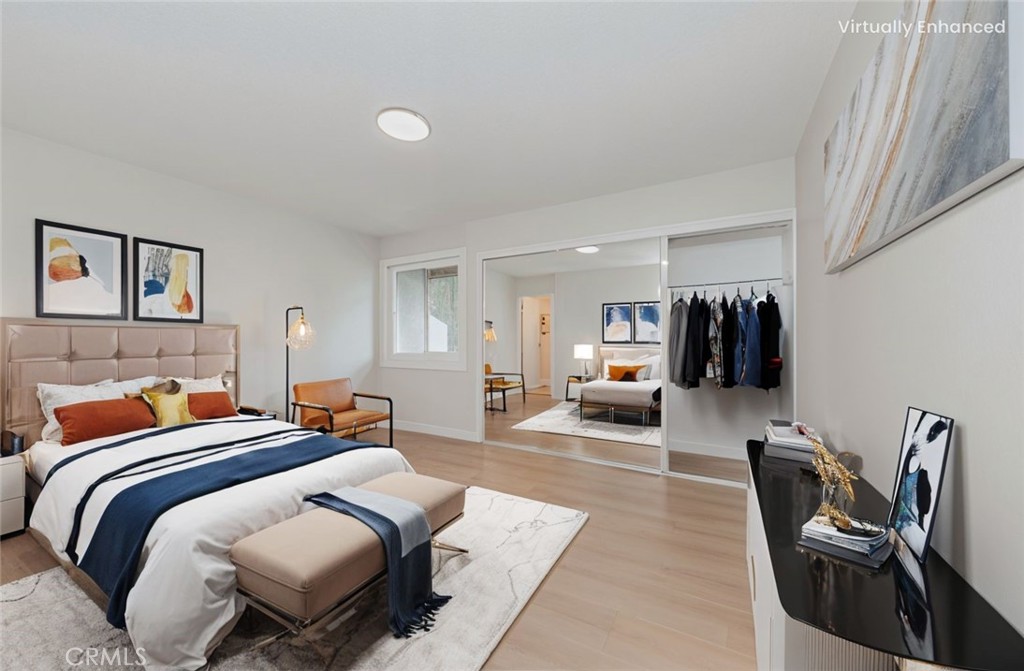 1525 Walnut Leaf Drive, Unit 211 Walnut, CA 91789 - Photo 12 of 26 a bedroom with furniture and a lamp