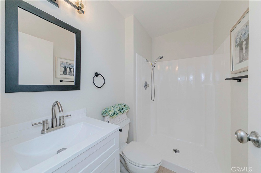 1525 Walnut Leaf Drive, Unit 211 Walnut, CA 91789 - Photo 14 of 26 a bathroom with a sink vanity granite toilet and shower