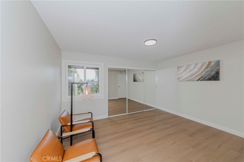 1525 Walnut Leaf Drive, Unit 211 Walnut, CA 91789 - Photo 15 of 26 wooden floor in an empty room with a window