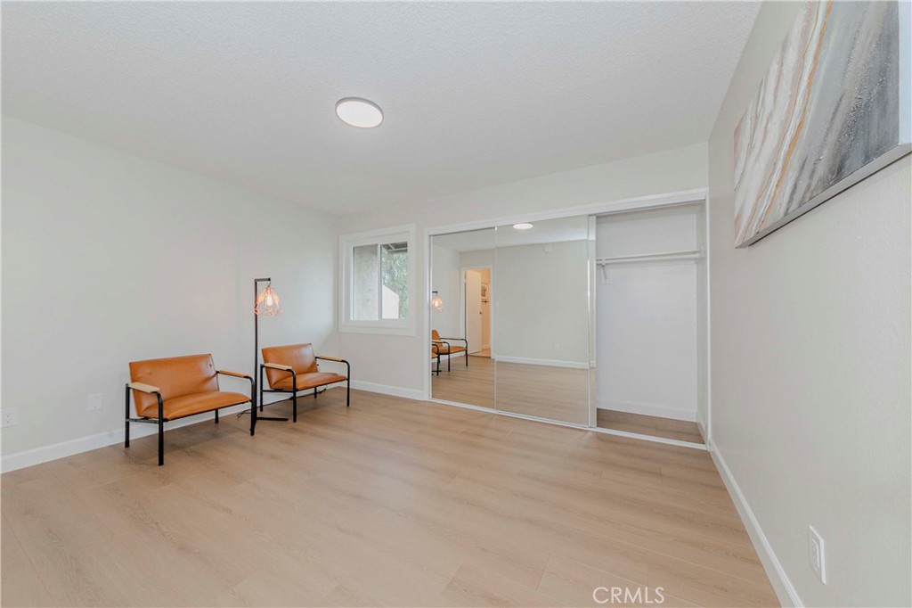 1525 Walnut Leaf Drive, Unit 211 Walnut, CA 91789 - Photo 16 of 26 a view of a livingroom with furniture and wooden floor