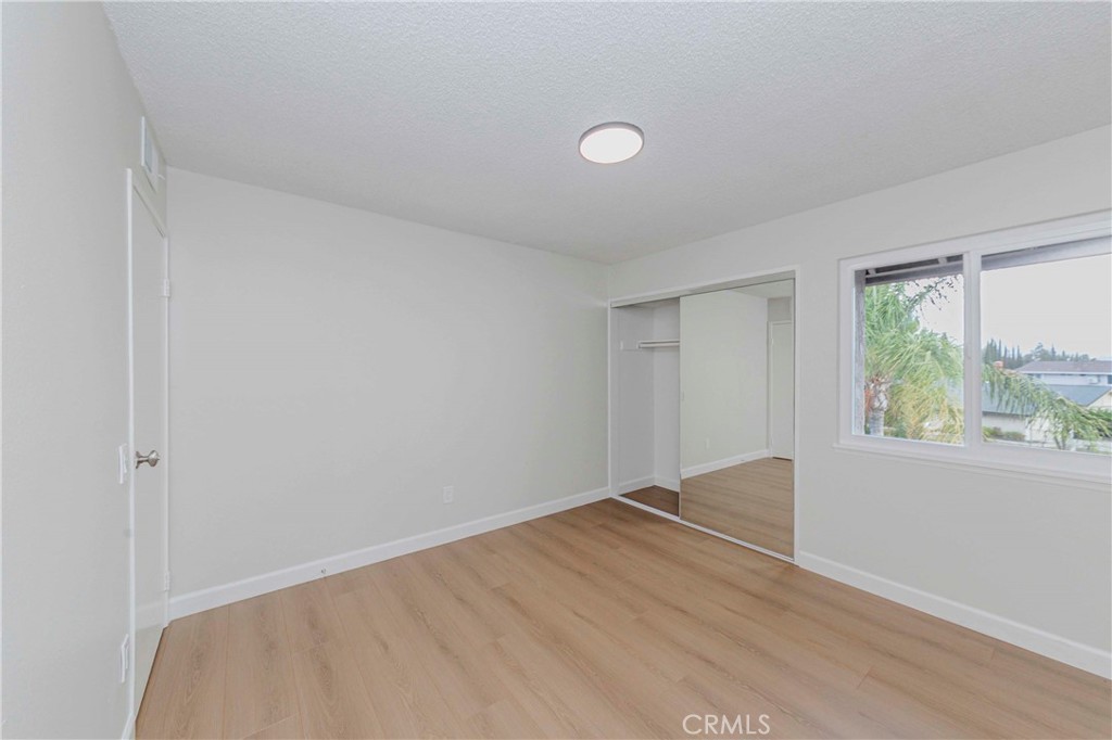 1525 Walnut Leaf Drive, Unit 211 Walnut, CA 91789 - Photo 18 of 26 an empty room with a window
