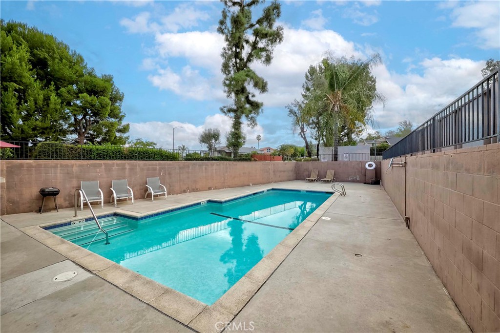1525 Walnut Leaf Drive, Unit 211 Walnut, CA 91789 - Photo 22 of 26 a view of swimming pool with a backyard