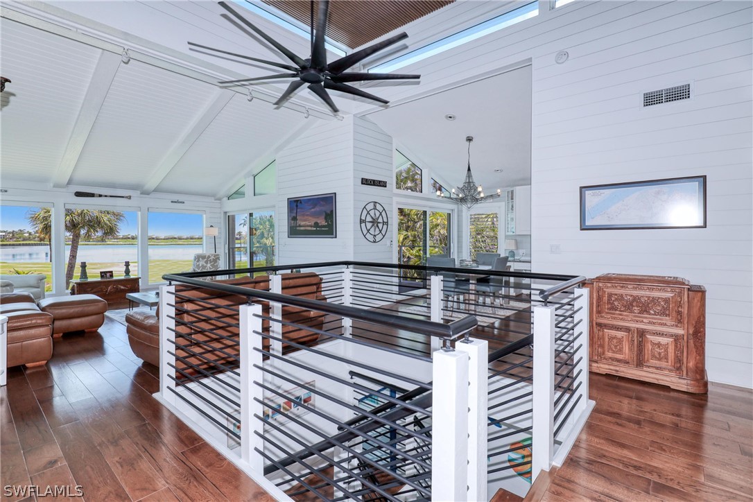 1021 Sand Castle Road Sanibel, FL 33957 - Photo 11 of 49 a living room with furniture and a wooden floor