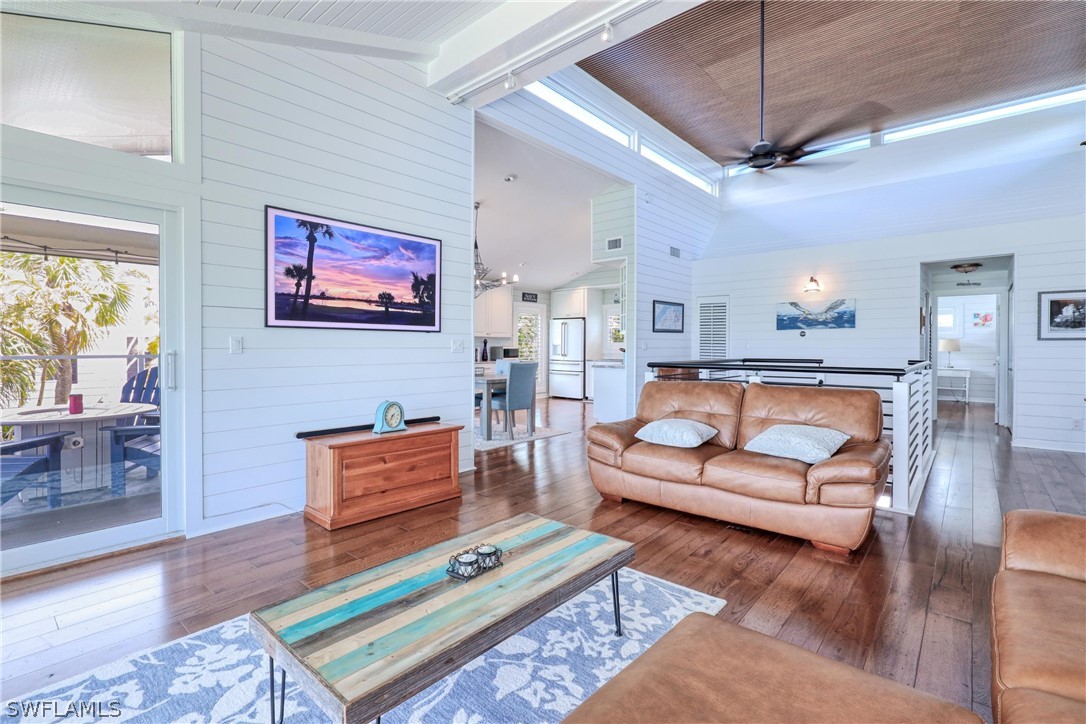 1021 Sand Castle Road Sanibel, FL 33957 - Photo 12 of 49 a bedroom with furniture and a wooden floor