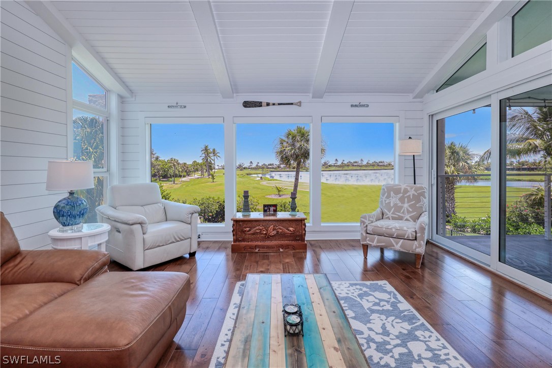 1021 Sand Castle Road Sanibel, FL 33957 - Photo 15 of 49 a living room with furniture and a large window