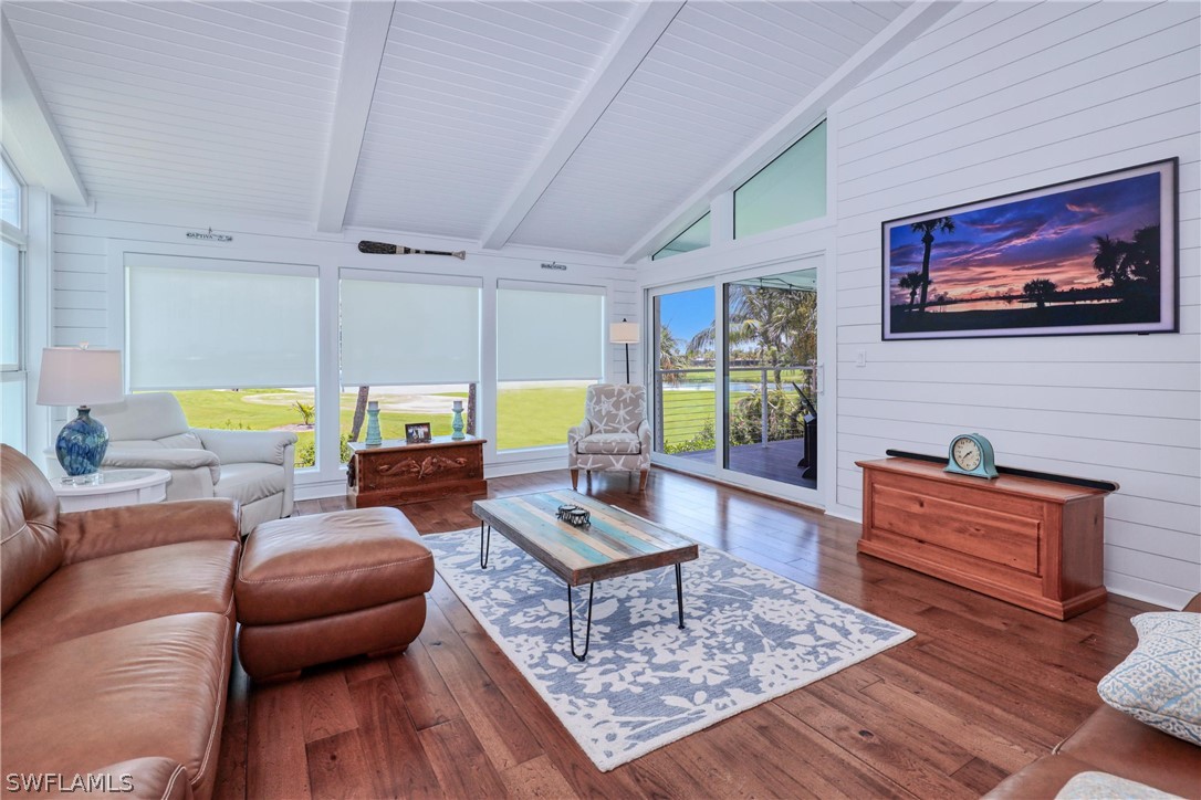 1021 Sand Castle Road Sanibel, FL 33957 - Photo 16 of 49 a living room with furniture and a wooden floor
