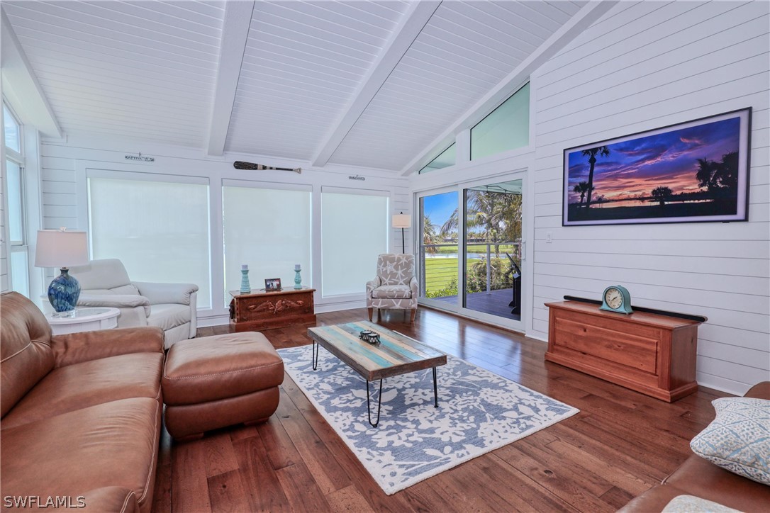 1021 Sand Castle Road Sanibel, FL 33957 - Photo 17 of 49 a living room with furniture a rug and a window