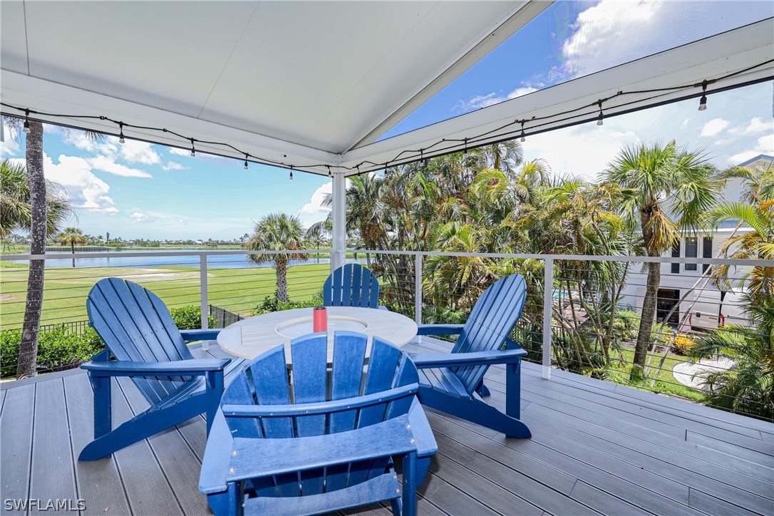 1021 Sand Castle Road Sanibel, FL 33957 - Photo 23 of 49 a view of a chairs and table in the balcony