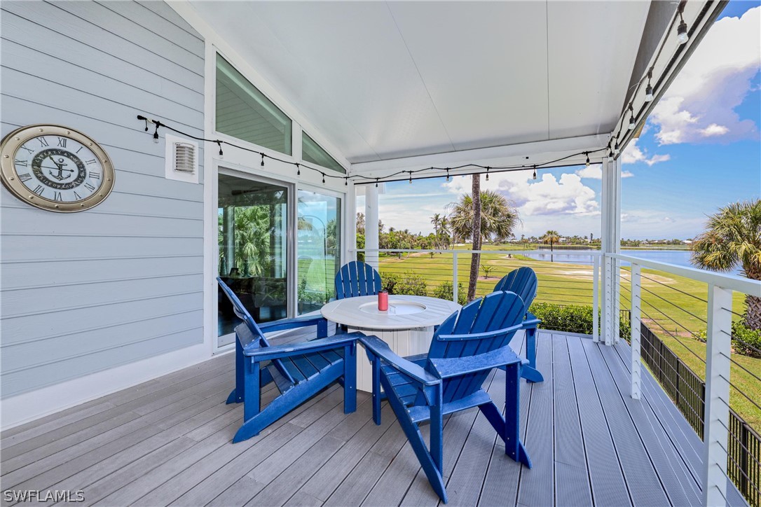1021 Sand Castle Road Sanibel, FL 33957 - Photo 24 of 49 a view of a deck with table and chairs