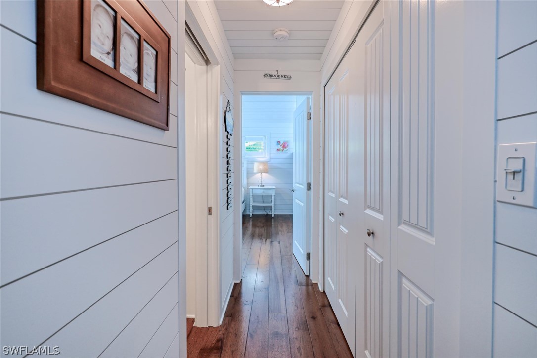1021 Sand Castle Road Sanibel, FL 33957 - Photo 25 of 49 a view of a hallway with wooden floor and staircase