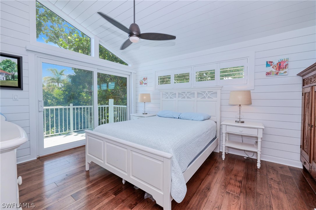1021 Sand Castle Road Sanibel, FL 33957 - Photo 26 of 49 a bedroom with a bed and a table
