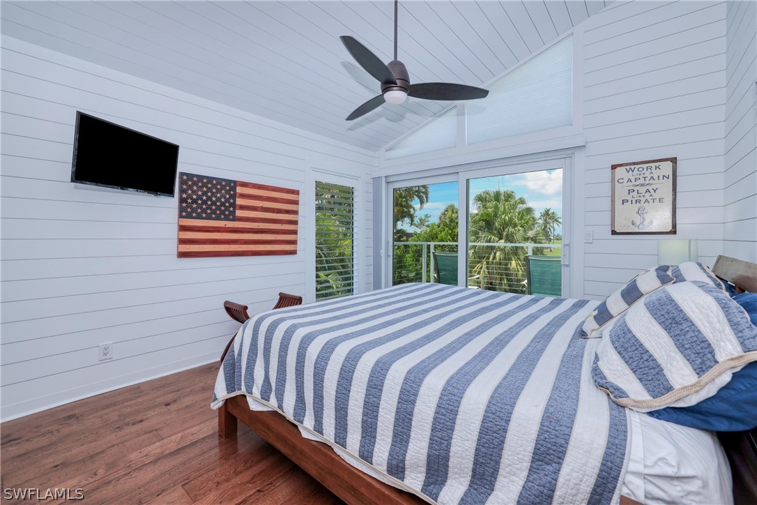 1021 Sand Castle Road Sanibel, FL 33957 - Photo 31 of 49 a bed sitting in a bedroom next to a window