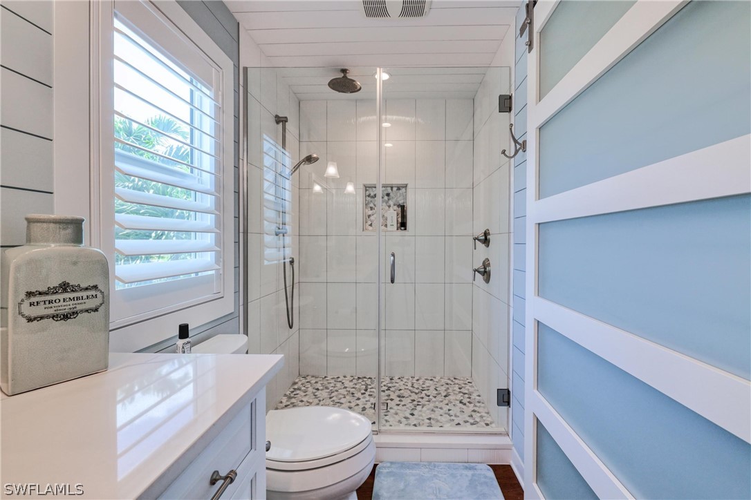 1021 Sand Castle Road Sanibel, FL 33957 - Photo 33 of 49 a bathroom with a sink a toilet and shower