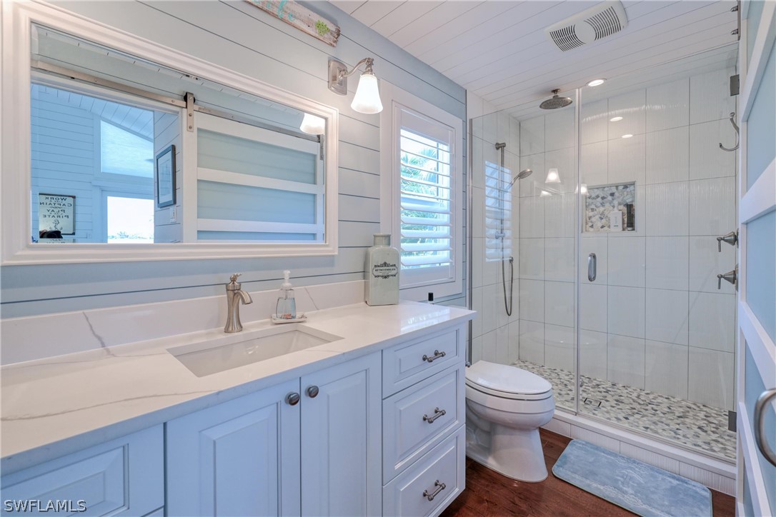 1021 Sand Castle Road Sanibel, FL 33957 - Photo 34 of 49 a bathroom with a sink a toilet and shower