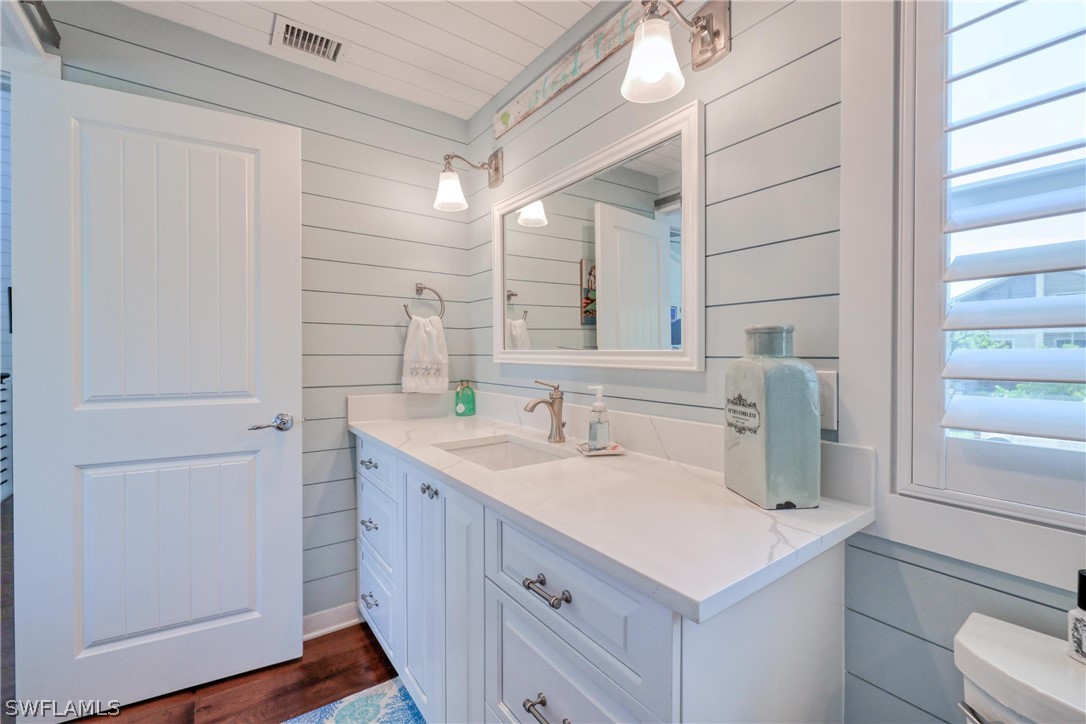 1021 Sand Castle Road Sanibel, FL 33957 - Photo 35 of 49 a bathroom with a sink and a mirror