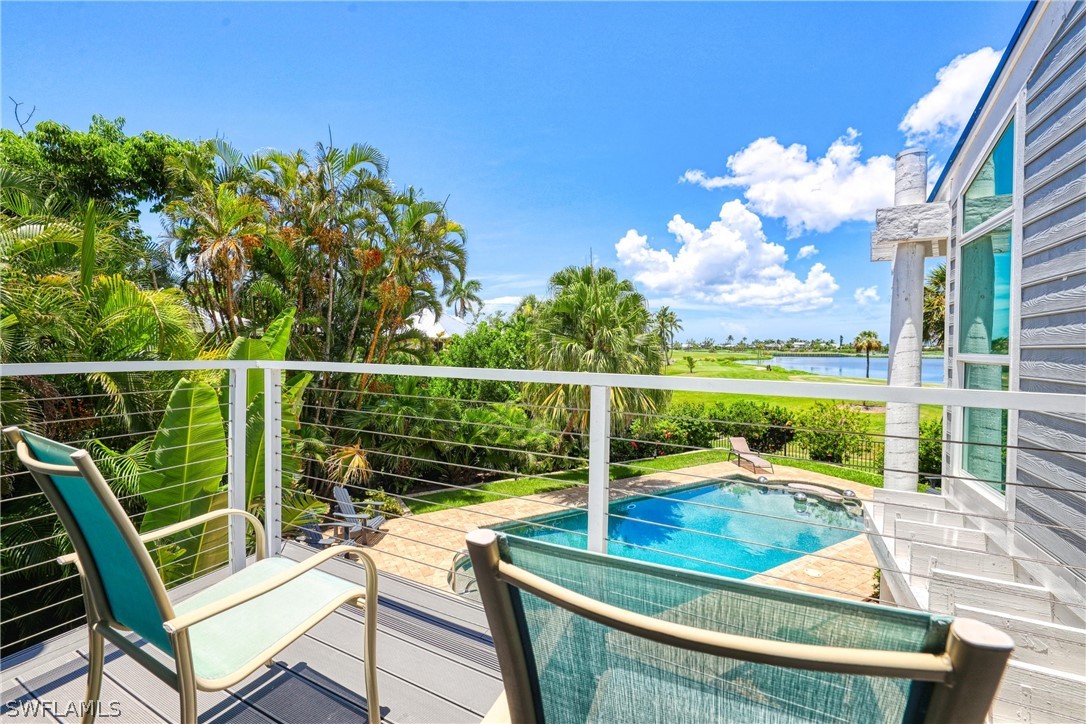 1021 Sand Castle Road Sanibel, FL 33957 - Photo 36 of 49 a view of a chairs and table in the balcony