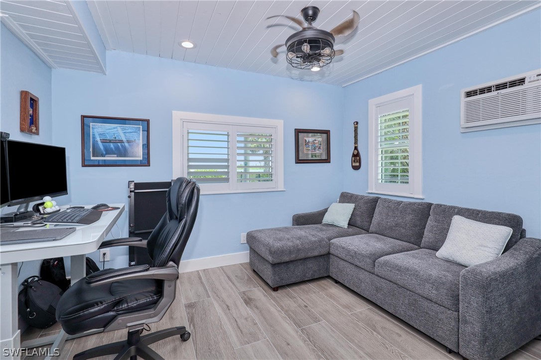 1021 Sand Castle Road Sanibel, FL 33957 - Photo 37 of 49 a view of a livingroom with workspace and a couch