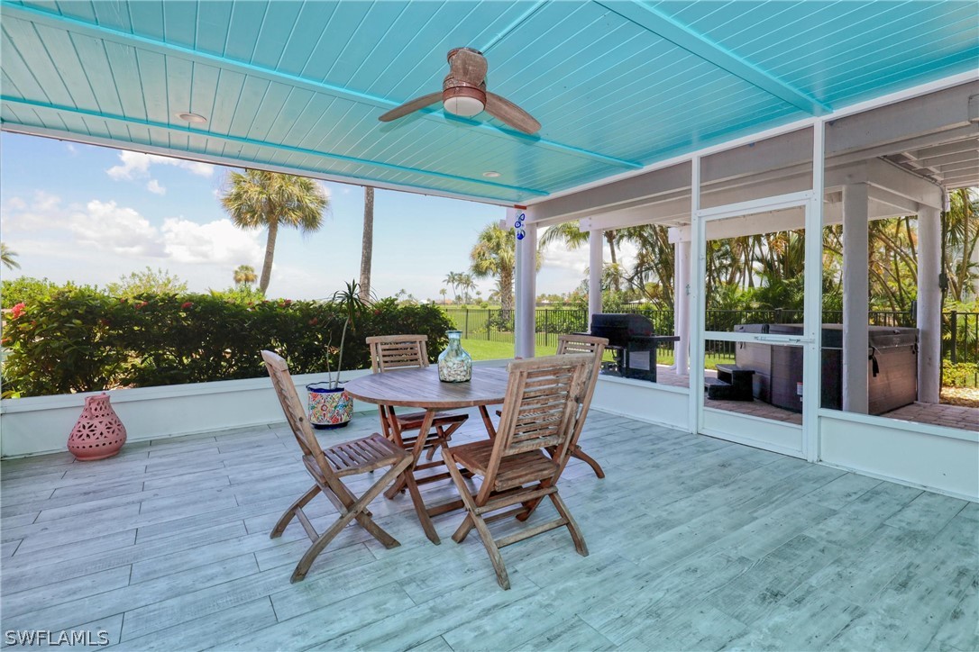 1021 Sand Castle Road Sanibel, FL 33957 - Photo 40 of 49 a dining area with furniture and outdoor view