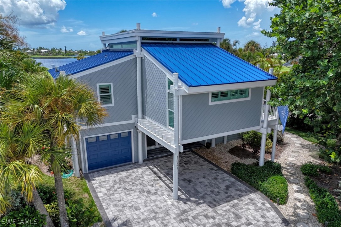 1021 Sand Castle Road Sanibel, FL 33957 - Photo 4 of 49 a house view with a backyard space