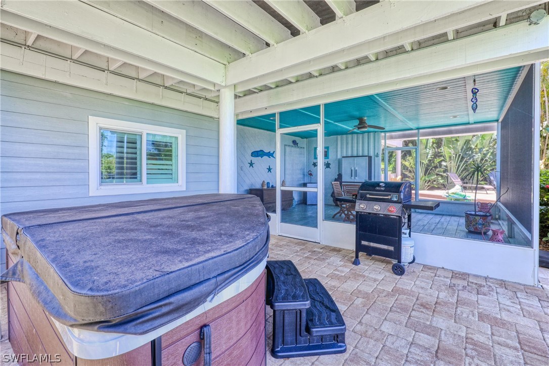 1021 Sand Castle Road Sanibel, FL 33957 - Photo 42 of 49 a living room filled with furniture and a rug