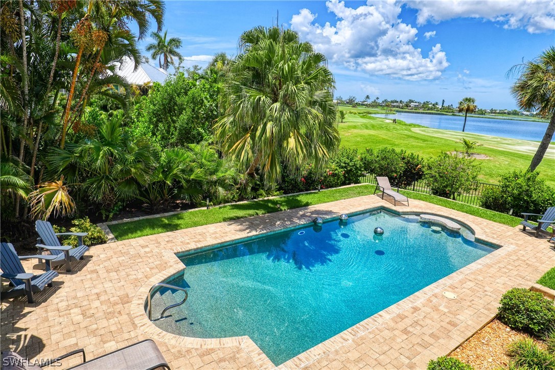 1021 Sand Castle Road Sanibel, FL 33957 - Photo 43 of 49 a view of swimming pool with a yard