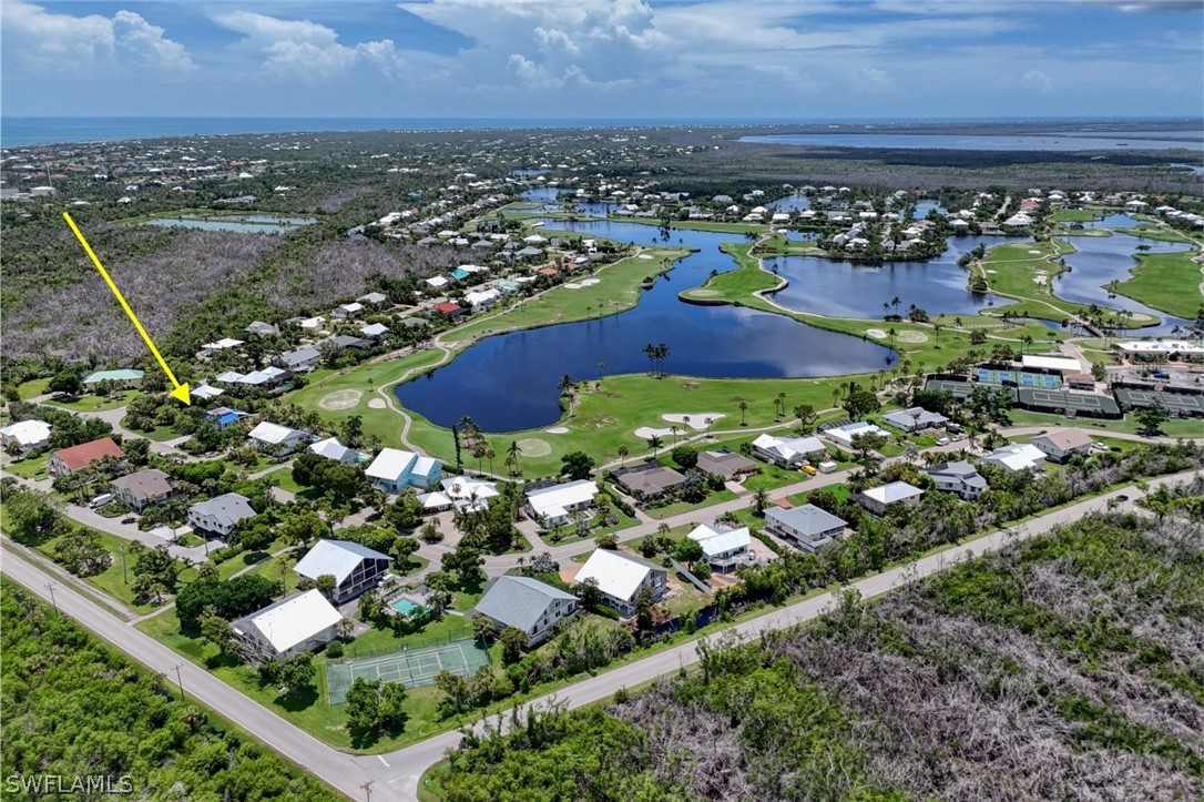 1021 Sand Castle Road Sanibel, FL 33957 - Photo 48 of 49 an aerial view of residential houses with outdoor space
