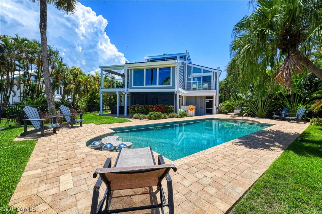 1021 Sand Castle Road Sanibel, FL 33957 - Photo 7 of 49 a view of an house with swimming pool and sitting area