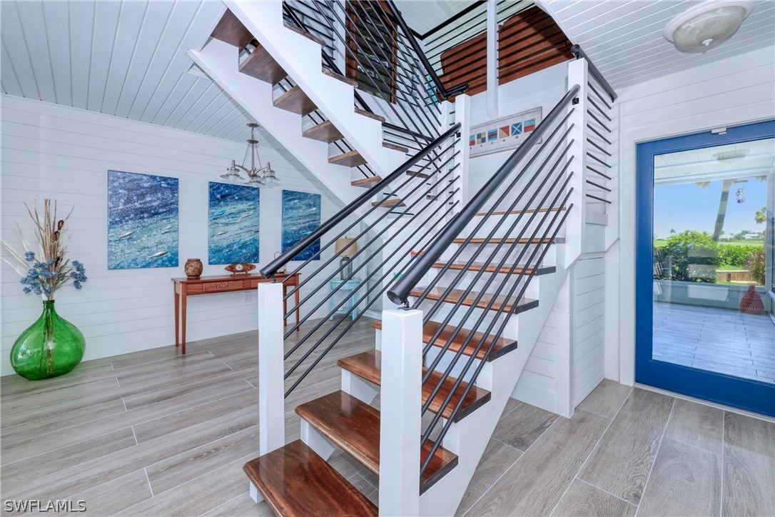 1021 Sand Castle Road Sanibel, FL 33957 - Photo 9 of 49 a view of entryway with wooden floor
