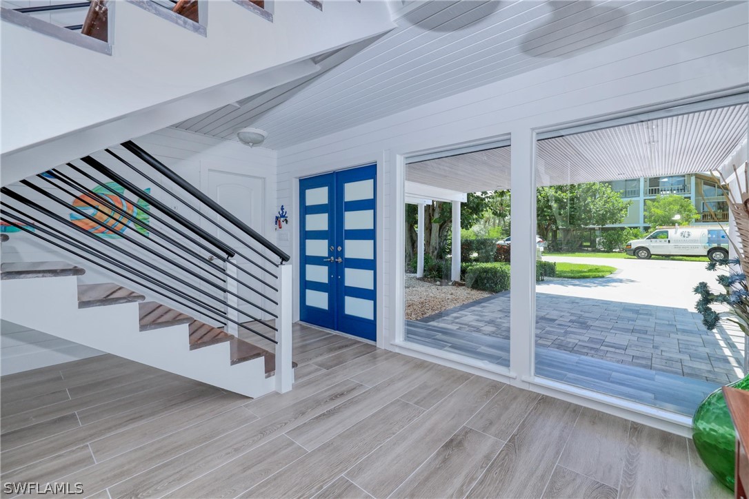1021 Sand Castle Road Sanibel, FL 33957 - Photo 10 of 49 a view of entryway with wooden floor and garden