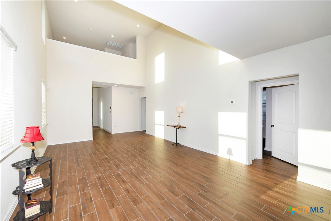 2069 Flametree Avenue New Braunfels, TX 78132 - Photo 11 of 46 a view of an empty room and wooden floor