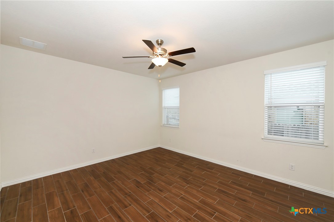 2069 Flametree Avenue New Braunfels, TX 78132 - Photo 20 of 46 an empty room with a window and a ceiling fan