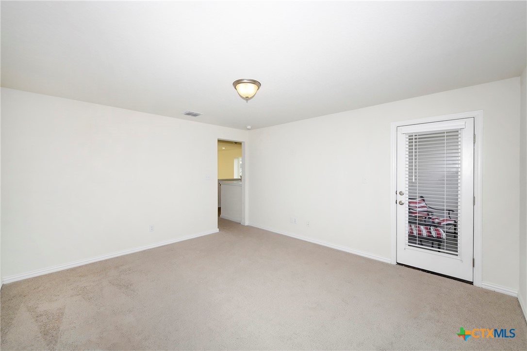 2069 Flametree Avenue New Braunfels, TX 78132 - Photo 25 of 46 an empty room with windows