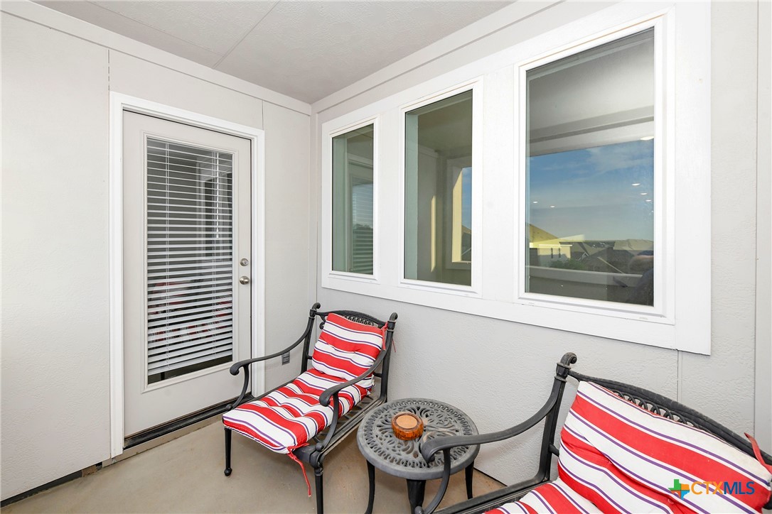 2069 Flametree Avenue New Braunfels, TX 78132 - Photo 27 of 46 a room with a bed and wooden floor